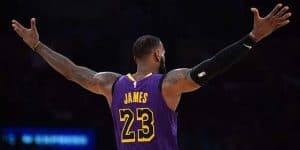 LeBron James facing away from the camera with his arms raised outwardly