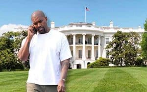 Kanye West in front of the White House talking on a cell phone
