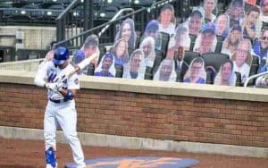 baseball player on the field in front of virtual fans