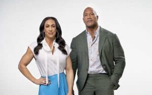 Dany Garcia standing to the left of the Rock, Dwayne Johnson
