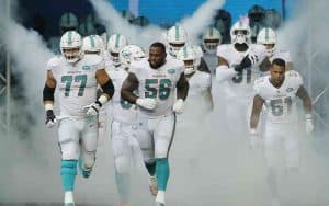 Miami Dolphins running onto the field