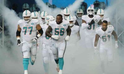 Miami Dolphins running onto the field