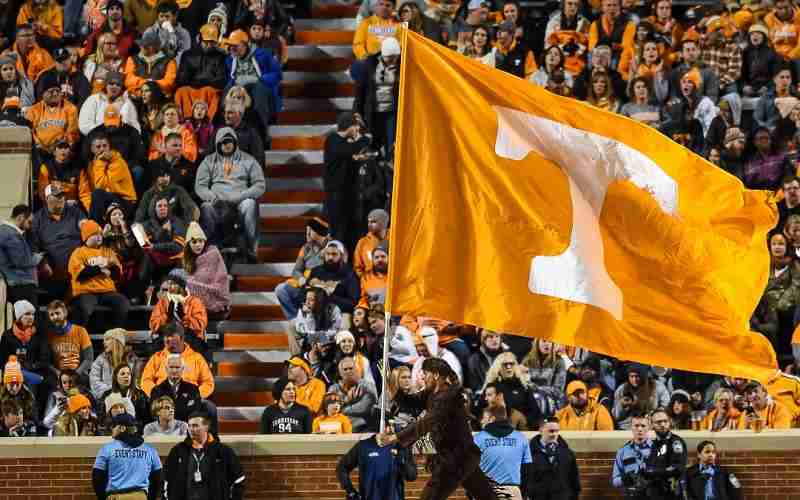 Tennessee Volunteers flag being ran around the field after a score