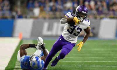 Dalvin Cook of the Vikings running past a Lions defender