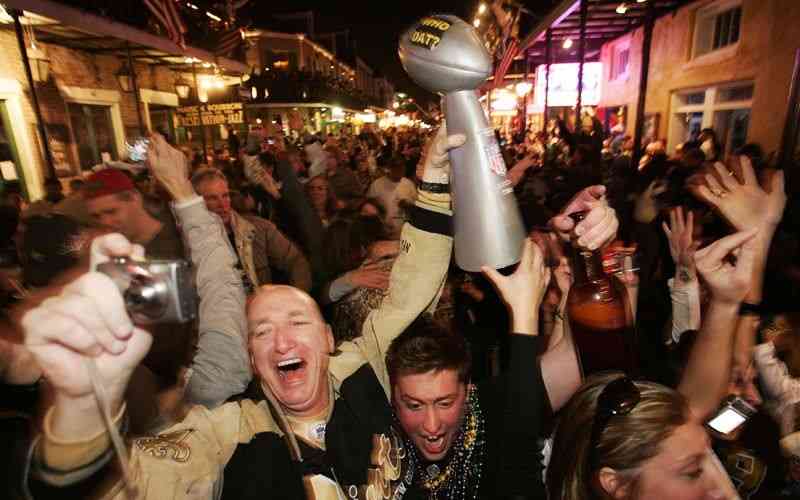 Saints fans celebrating on Bourbon Street