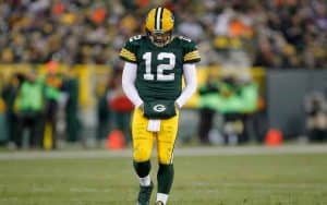 Aaron Rogers walking off the field looking sad
