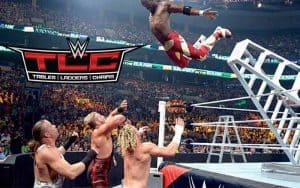 WWE Wrestler jumping off of a ladder onto other wrestlers