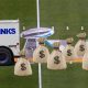 Bank truck dropping bags of cash on the Super Bowl 55 field