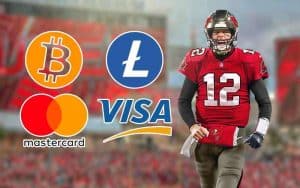 tampa bay buccaneers qb tom brady with bitcoin, litecoin, visa, and mastercard logos