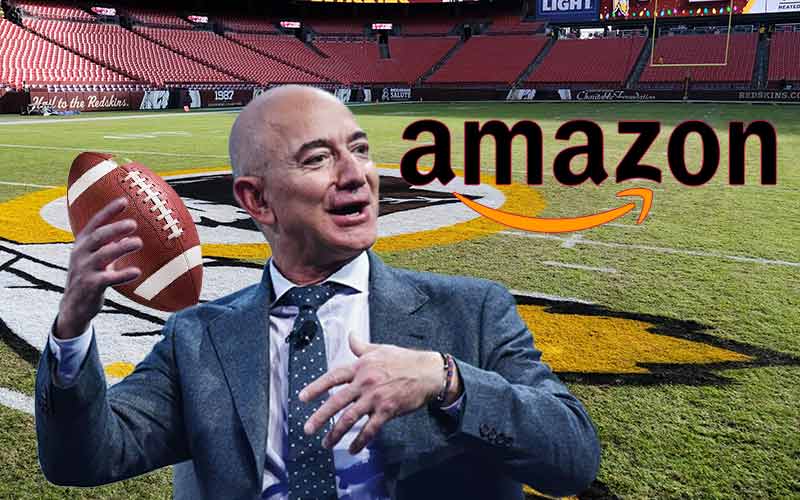 Amaon's Jeff Bezos throws a football while he considers his NFL betting odds to purchase the Washington Football Team