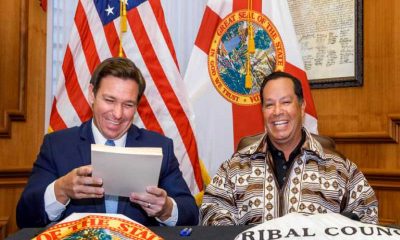 ron desantis and chief osceola laughing