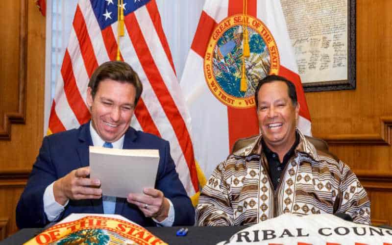 ron desantis and chief osceola laughing