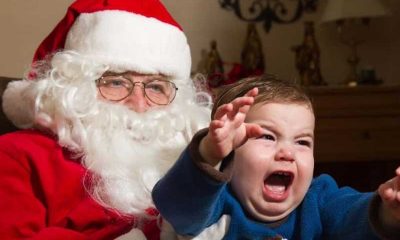 sad santa with screaming child