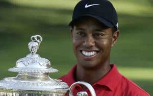 image of Tiger Woods holding trophy
