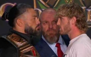 Logan Paul Roman Reigns face off