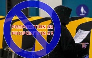 a female California resident voting against Proposition 26 and 27 at the ballot box