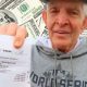 Mattress Mack holding his bet slip for his winning Astros World Series wager