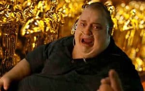 Brendan Fraser as Charlie from Whale in front of a sea of Oscar Awards