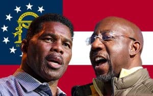 Herschel Walker and Raphael Warnock in front of a Georgia State Flag