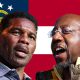 Herschel Walker and Raphael Warnock in front of a Georgia State Flag