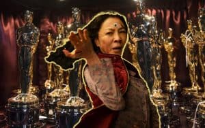 Michelle Yeoh in front of a bunch of Oscars