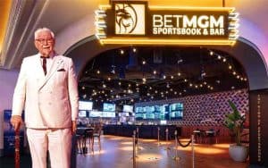 Col Sanders standing in the entryway to a Kentucky sportsbook