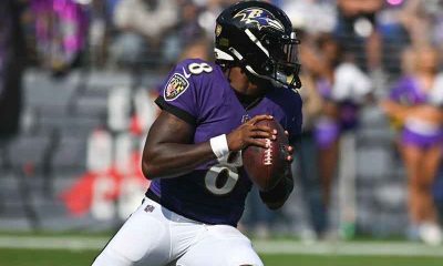 Baltimore Ravens QB Lamar Jackson drops back for a pass