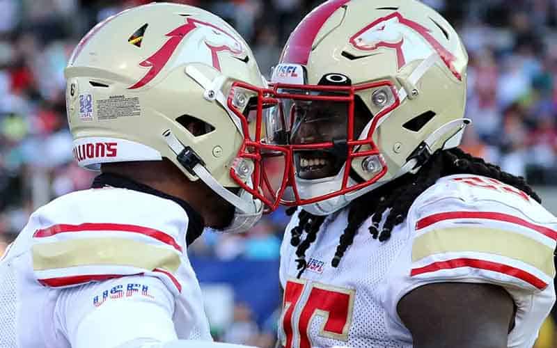 two Birmingham Stallions players celebrating