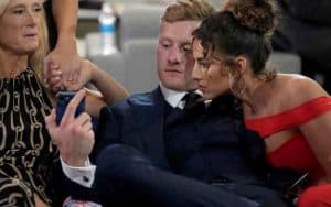 Will Levis looking at his cell phone backstage at the NFL Draft