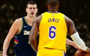 LeBron James with Nikola Jokic preparing to defend