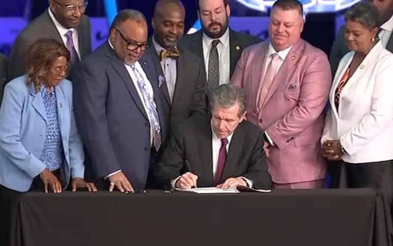 Governor Cooper signing a North Carolina sports betting bill