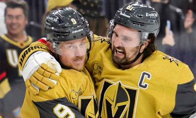 Two Vegas Golden Knights celebrating a win