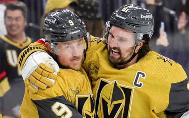 Two Vegas Golden Knights celebrating a win