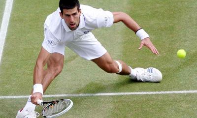 Novak Djokovic stretching for a ball at Wimbledon 2023