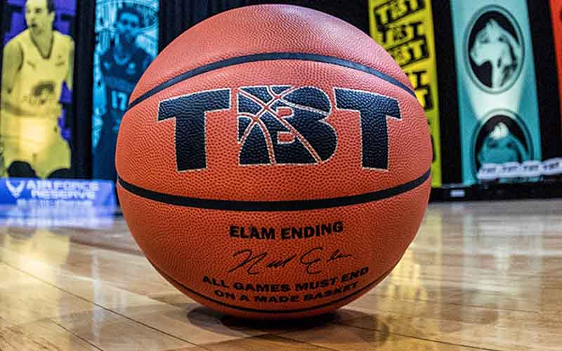 a close up of a basketball with a TBT logo on it