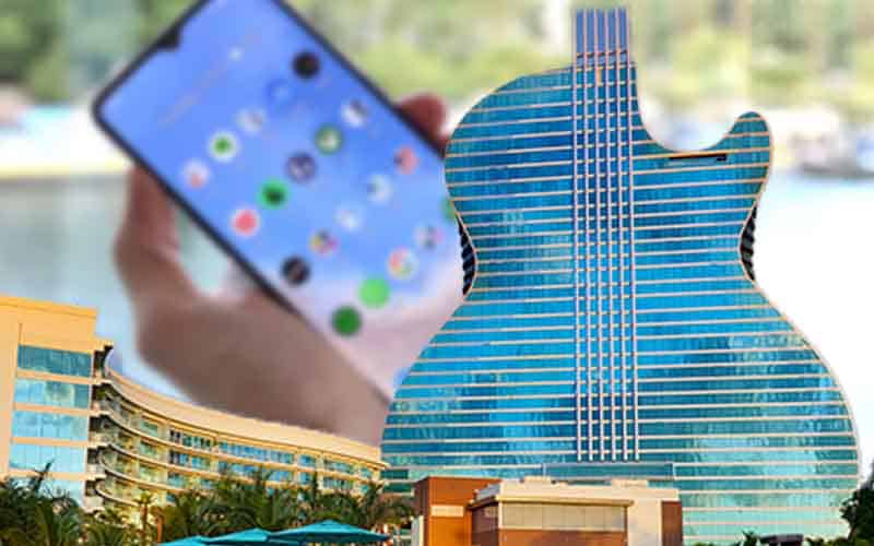 Seminole Hard Rock Casino Hollywood with a mobile phone in the background