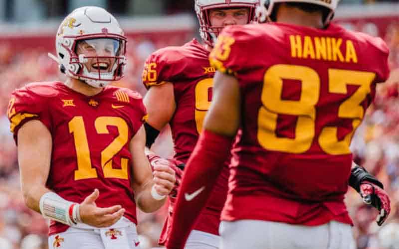 Iowa State QB Hunter Dekkers celebrating with two other teammates