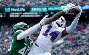 the Bills' Stefon Diggs catching a pass on a New York Jets defender