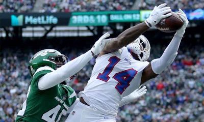 the Bills' Stefon Diggs catching a pass on a New York Jets defender