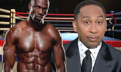 Terrell Owens and Stephen A. Smith in front of a boxing ring
