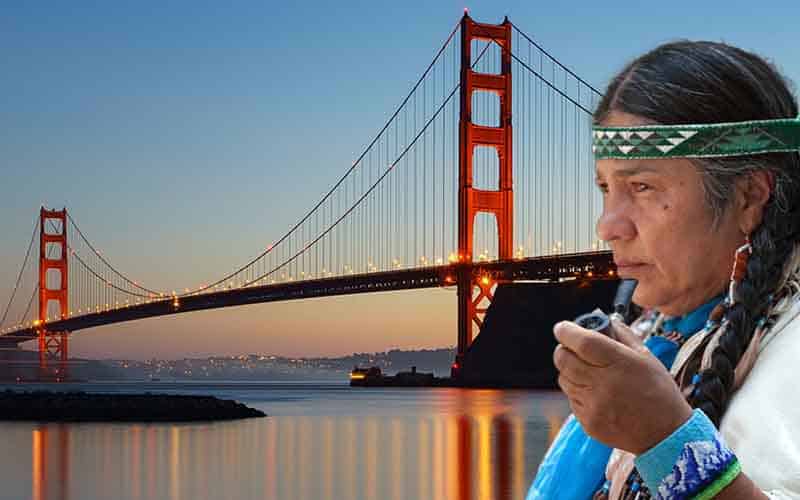 a Native American overlooking the Golden Gate Bridge