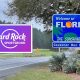 A Hard Rock Sportsbook sign next to the Welcome to Florida sign on the highway