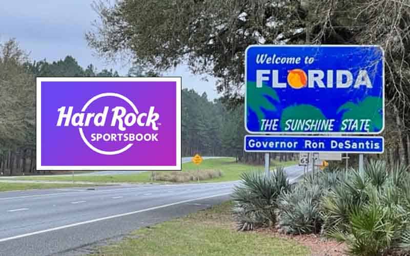 A Hard Rock Sportsbook sign next to the Welcome to Florida sign on the highway