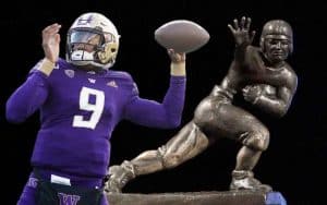 Michael Penix Jr. throwing a football next to a Heisman Trophy