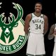 Giannis Antetokounmpo and Damian Lillard standing in front of a Bucks logo