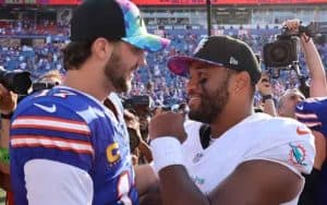 Josh Allen of the Bills talking to Tua Tagovailoa of the Dolphins
