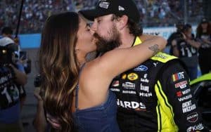 Ryan Blaney kissing his girlfriend after a NASCAR win