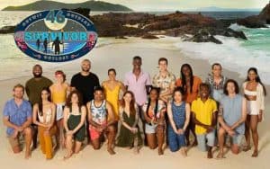 Survivor 46 cast on the beach with a Survivor logo