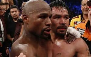 Floyd Mayweather and Manny Pacquiao embracing after their first fight