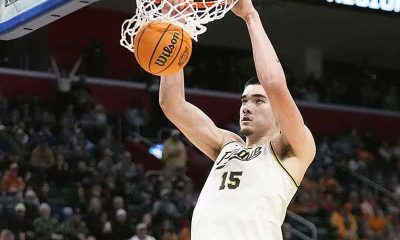 Zach Edey of the Purdue Boilermakers dunking a basketball